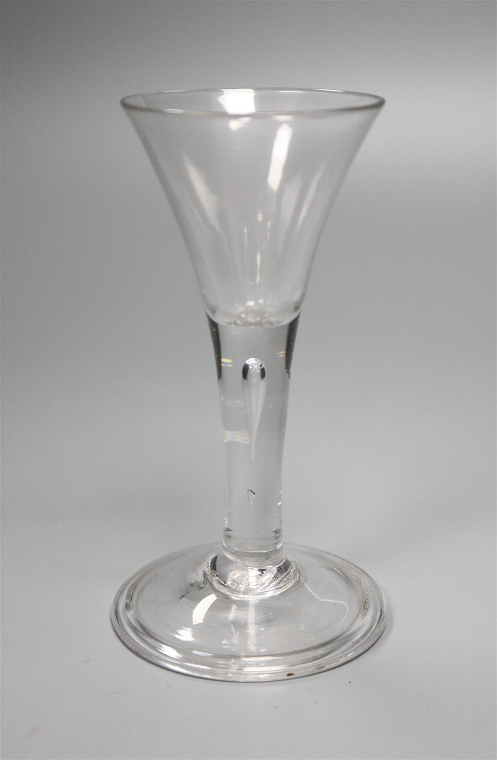 A drawn trumpet drinking glass, c.1740 on a folded foot, 15cm